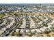 Aerial view of a community featuring numerous houses with pools, situated near industrial areas at 1231 N Layman St, Gilbert, AZ 85233