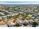 Aerial view showcasing a residential area with houses, a park, and surrounding landscape at 1231 N Layman St, Gilbert, AZ 85233