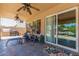 Relaxing covered patio, adjacent to the pool, with ceiling fans at 1231 N Layman St, Gilbert, AZ 85233