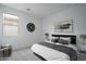 Cozy bedroom features neutral colors, soft carpet, and large window at 12722 W Luxton Ln, Avondale, AZ 85323
