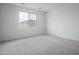 Carpeted bedroom featuring natural light from the window, ample open space and neutral paint at 12722 W Luxton Ln, Avondale, AZ 85323