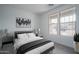 Stylized bedroom with modern decor and light coming through the window at 12722 W Luxton Ln, Avondale, AZ 85323