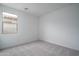 A clean and bright bedroom with neutral carpet and natural light at 12722 W Luxton Ln, Avondale, AZ 85323
