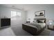 Cozy bedroom featuring a window, dresser, carpet, and a comfortable bed at 12722 W Luxton Ln, Avondale, AZ 85323