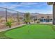 Backyard with putting green, pool, and patio furniture at 13331 E Parkview Ln, Scottsdale, AZ 85255