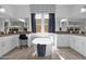 Elegant bathroom featuring a freestanding tub and dual vanities at 13331 E Parkview Ln, Scottsdale, AZ 85255