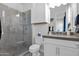 Clean bathroom with a walk-in shower, gray tile, and a modern vanity at 13331 E Parkview Ln, Scottsdale, AZ 85255