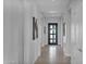 Bright and airy entryway with tile flooring and modern light fixtures at 13331 E Parkview Ln, Scottsdale, AZ 85255