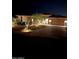 Night view of home's exterior, landscaping, and driveway at 13331 E Parkview Ln, Scottsdale, AZ 85255