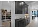 Well-organized pantry with ample shelving and dark cabinetry at 13331 E Parkview Ln, Scottsdale, AZ 85255