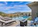 Swimming pool with lounge chairs and fire pit at 13331 E Parkview Ln, Scottsdale, AZ 85255