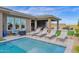 Luxury pool with multiple lounge chairs and a covered patio at 13331 E Parkview Ln, Scottsdale, AZ 85255