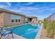 Relaxing swimming pool, spacious patio, and a view of the home at 13331 E Parkview Ln, Scottsdale, AZ 85255