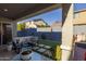 Covered patio with seating area and artificial turf at 1336 E Sierra Vista Dr, Phoenix, AZ 85014