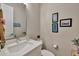 Clean bathroom with a sink, toilet, and decorative framed art at 1336 E Sierra Vista Dr, Phoenix, AZ 85014