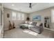 Bright bedroom with gray sectional sofa and large windows at 1336 E Sierra Vista Dr, Phoenix, AZ 85014