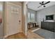 Entryway with hardwood floors, a small home office, and white door at 1336 E Sierra Vista Dr, Phoenix, AZ 85014