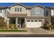 Two-story home with gray siding and a white garage door at 1336 E Sierra Vista Dr, Phoenix, AZ 85014