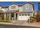 Two-story home with white garage doors and landscaping at 1336 E Sierra Vista Dr, Phoenix, AZ 85014