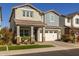 Two-story home with a white garage door and landscaping at 1336 E Sierra Vista Dr, Phoenix, AZ 85014