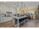 Modern kitchen with white cabinets, large island, and pendant lights at 1336 E Sierra Vista Dr, Phoenix, AZ 85014