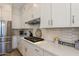 Modern kitchen features stainless steel appliances and white shaker cabinets at 1336 E Sierra Vista Dr, Phoenix, AZ 85014