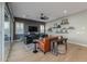 Living room with hardwood floors, orange couch, and built-in shelves at 1336 E Sierra Vista Dr, Phoenix, AZ 85014