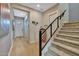 Modern staircase with metal railing and hardwood floors at 1336 E Sierra Vista Dr, Phoenix, AZ 85014