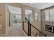 Upstairs hallway with loft area and view into bedroom at 1336 E Sierra Vista Dr, Phoenix, AZ 85014