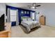 Bright bedroom with blue accent wall and comfortable bed at 15742 W Watson W Ln, Surprise, AZ 85379