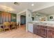 Dining area with wood table and view into living room at 15742 W Watson W Ln, Surprise, AZ 85379