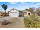 One-story house with attached garage and desert landscaping at 15742 W Watson W Ln, Surprise, AZ 85379