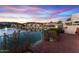 Brick patio overlooks lake with sunset views at 16206 S 11Th Pl, Phoenix, AZ 85048