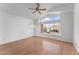 Spacious bedroom with wood floors and large window at 16206 S 11Th Pl, Phoenix, AZ 85048