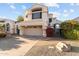 Two-story home with attached garage and landscaping at 16206 S 11Th Pl, Phoenix, AZ 85048