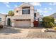 Two-story home with attached garage and landscaping at 16206 S 11Th Pl, Phoenix, AZ 85048