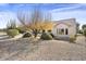 Home exterior showcasing a backyard with desert plants at 16310 W Boulder Dr, Surprise, AZ 85374