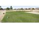 Golf course view with lush green grass and water features at 16310 W Boulder Dr, Surprise, AZ 85374