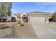 House exterior with stone accents and landscaping at 16310 W Boulder Dr, Surprise, AZ 85374