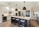 Modern kitchen features a large island with seating and stainless steel appliances at 16310 W Boulder Dr, Surprise, AZ 85374