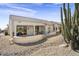 Covered patio with seating area and desert landscape at 16310 W Boulder Dr, Surprise, AZ 85374