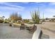 Relaxing patio with golf course views and desert landscaping at 16310 W Boulder Dr, Surprise, AZ 85374