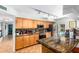 Well-equipped kitchen boasting granite countertops and ample cabinetry at 1643 W Harmont Dr, Phoenix, AZ 85021