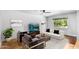 Bright living room featuring a neutral color palette and large window at 1643 W Harmont Dr, Phoenix, AZ 85021