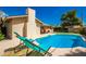 Sparkling blue pool with spacious backyard and lounge chairs at 1643 W Harmont Dr, Phoenix, AZ 85021