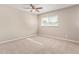 Bright bedroom with ceiling fan and neutral carpeting at 1682 W Campbell Ave, Phoenix, AZ 85015