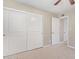 Bedroom with double door closet and neutral wall colors at 1682 W Campbell Ave, Phoenix, AZ 85015