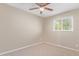 Bedroom with ceiling fan and large window at 1682 W Campbell Ave, Phoenix, AZ 85015