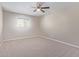 Bright bedroom with neutral walls, carpet, ceiling fan and window at 1682 W Campbell Ave, Phoenix, AZ 85015