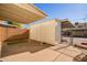 Covered patio with artificial grass and adjacent storage unit at 1682 W Campbell Ave, Phoenix, AZ 85015